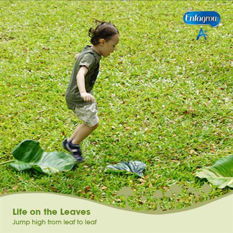 toddler playing on grass