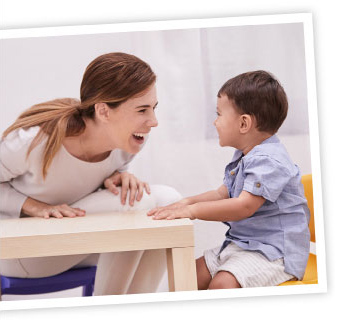 mom speaking happily with toddler