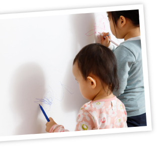 Kids painting on walls