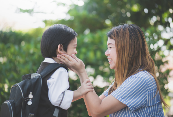 Mom sending child to childcare centre in Singapore